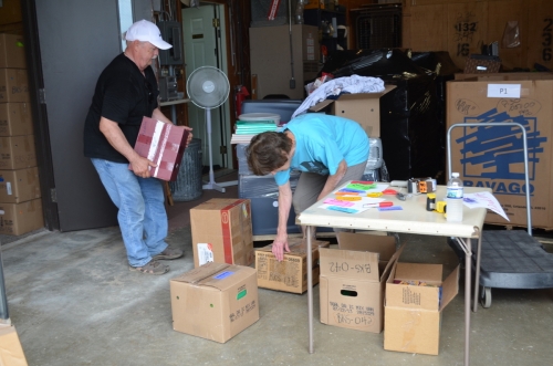 E-Quip Africa volunteers pack donated school supplies for shipment to Ghana, West Africa.